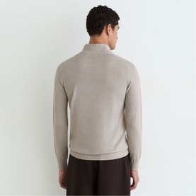 Model wearing Reiss stone mouline knit polo jumper, back view, paired with dark brown trousers