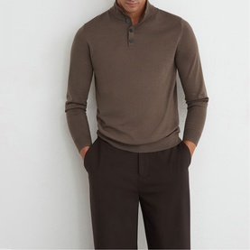 Model wearing Reiss ridge brown button neck knit jumper, styled with dark brown tailored trousers