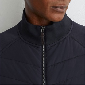 Reiss blue quilted jacket close-up, showing zip-up funnel neck collar and structured stitching detail