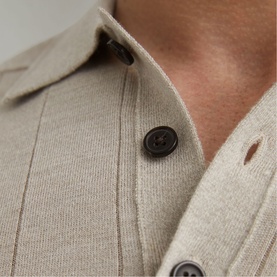 Reiss stone moulin&eacute; knit shirt close-up showing dark brown buttons and fine vertical stripe texture at collar