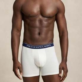 Model wearing Ralph Lauren Three-Pack Logo Boxer Briefs in paper white with navy logo elasticated waistband, contoured pouch and clean hems.