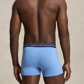 Model wearing Ralph Lauren Classic Stretch Trunk in Bristol Blue, showing logo elastic waistband and rear view of trunk-style fit.