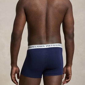 Model wearing Ralph Lauren Classic Stretch Trunk 3-Pack in navy, shown from behind, with signature logo elastic waistband visible.