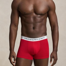 Model wearing Ralph Lauren Classic Stretch Trunk in red, featuring white signature logo elastic waistband and contoured pouch fit.