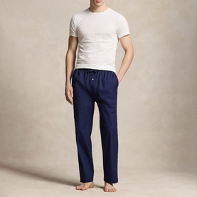 Model wearing navy blue drawstring lounge trousers styled with a white crew neck T-shirt