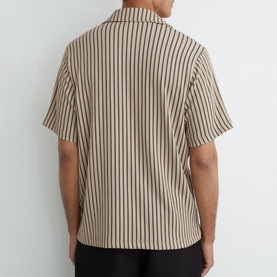 Model wearing Reiss beige striped short-sleeve shirt with camp collar, rear view