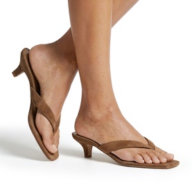 Model wearing Steve Madden Tracie Heeled Sandals in brown suede, featuring thong toe strap and kitten heel