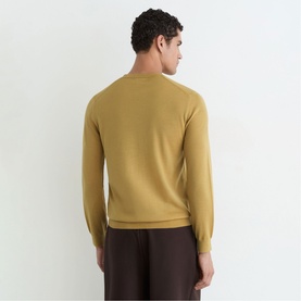 Model wearing Reiss yellow fine-knit crew neck jumper, back view, styled with dark brown trousers