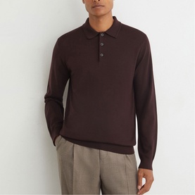 Model wearing Reiss red long-sleeve knit polo shirt with three-button placket, styled with grey trousers.