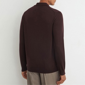 Model wearing Reiss red long-sleeve polo shirt, rear view, styled with light grey trousers
