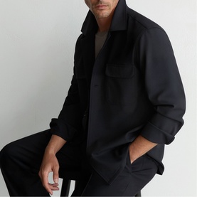 Model wearing Reiss navy blue overshirt jacket with chest pocket, styled with matching blue trousers