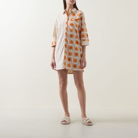Model wearing Chelsea Peers Sunshine Tile Print Night Dress in Sunshine Grid, with collar, three-quarter sleeves and curved hem, styled with white