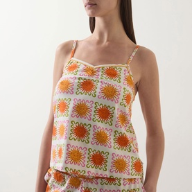 Model wearing Chelsea Peers Sunshine Tile Print Pyjama Set cami top in Sunshine Grid, orange and pink floral tile print, spaghetti straps, with