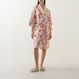 Model wearing Chelsea Peers Siesta Tiger Print Cheesecloth Robe in Fiesta Siesta All Over Print, styled with fluffy slippers