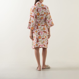 Model wearing Chelsea Peers Siesta Tiger Print Cheesecloth Robe in Fiesta Siesta All Over Print, back view, with fluffy slippers