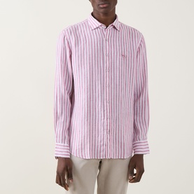 Model wearing Rodd & Gunn Seadown Stripe Shirt in RoseWater, pink stripe cotton, pointed collar, long sleeves, paired with stone trousers.