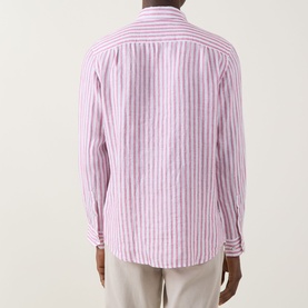 Model wearing Rodd & Gunn Seadown Stripe Shirt in RoseWater, rear view showing vertical stripe pattern, long sleeves, single cuff, styled with beige
