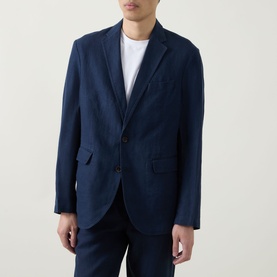 Model wearing Rodd & Gunn Campbell Island Single-Breasted Blazer in navy linen, notched lapels, styled with white crew-neck tee and navy trousers.