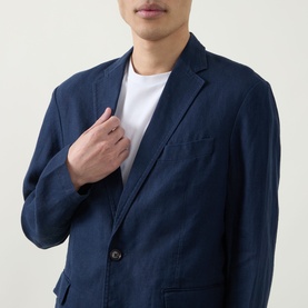 Model wearing Rodd & Gunn Campbell Island Single-Breasted Blazer in navy linen, notched lapels, styled with a white crew-neck T-shirt.