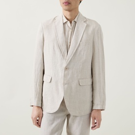 Model wearing Rodd & Gunn Campbell Island Single-Breasted Blazer in Oatmeal linen, styled with matching trousers and open-collar shirt.
