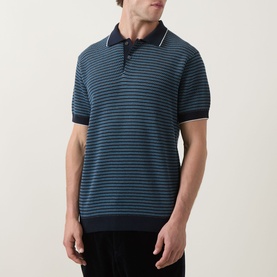Model wearing Rodd & Gunn Oyster Island Striped Knitted Polo Shirt in teal, with navy stripes, polo collar and short sleeves