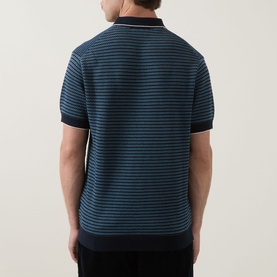 Model wearing Rodd & Gunn Oyster Island Striped Knitted Polo Shirt in teal, rear view showing horizontal stripe pattern and polo collar.