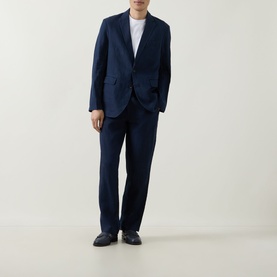 Model wearing Rodd & Gunn Spencer Bay Linen Trousers in navy, styled with matching navy blazer and white T-shirt.