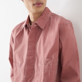 Model wearing Farah Vintage Mattison Denim Jacket in Dusty Red, showing pointed collar, front pockets and contrast stitching detail.