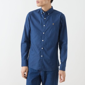 Model wearing Farah Vintage Brewer Logo Shirt in Aegean Blue, long sleeve cotton with button-down collar and chest logo, styled with blue denim jeans