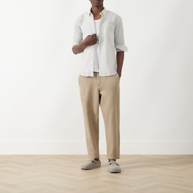 Model wearing Farah Vintage Stone Grey casual shirt, styled with beige chinos and grey suede loafers