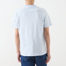 Model wearing Farah Vintage Castle Logo Striped T-Shirt in Blue Nickle, rear view, styled with blue denim jeans.