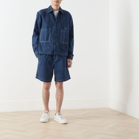 Model wearing Farah Vintage Swinton Logo Drawstring Shorts in Aegean Blue denim, styled with matching denim jacket and white trainers.