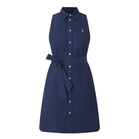 Polo Ralph Lauren Polo Player Mini Shirt Dress in navy. Sleeveless, pointed collar, full button front, self-tie belt, embroidered polo player logo.