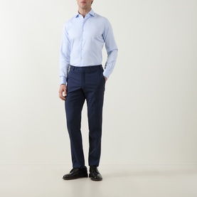 Model wearing Gherardi Light Blue Double Cuff Regular cotton formal shirt, styled with navy trousers and black leather shoes.