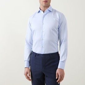 Model wearing Gherardi Light Blue Double Cuff Regular shirt in 100% cotton, styled with navy trousers