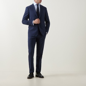 Model wearing Gherardi Light Blue Double Cuff Regular shirt styled with navy suit and tie, black dress shoes.
