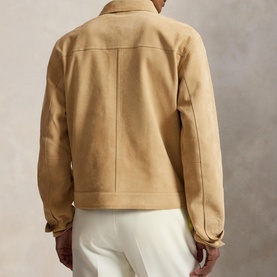 Model wearing Ralph Lauren Cafe Tan casual jacket, rear view, styled with white trousers