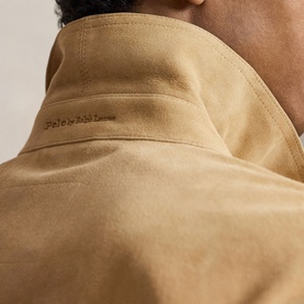 Model wearing Ralph Lauren cafe tan casual jacket, close-up of suede-effect collar and back neck detail with embroidered logo