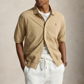 Model wearing Ralph Lauren Vintage Khaki short-sleeve casual shirt with snap buttons, styled with white drawstring trousers