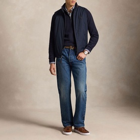 Model wearing Ralph Lauren Navy Heather Half Zip, styled with navy jacket, blue jeans, and brown loafers.