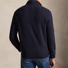 Model wearing Ralph Lauren Navy Heather half-zip knit sweater, back view, styled with blue jeans.