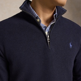 Model wearing Ralph Lauren Navy Heather half-zip knit pullover with embroidered pony logo, styled over a blue striped shirt.