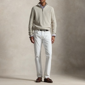 Model wearing Ralph Lauren Light Walnut Brown Heather half-zip knit, styled with white jeans, striped shirt and brown loafers.