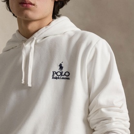 Model wearing Ralph Lauren Polo white pullover hoodie with embroidered logo on chest, close-up shot showing hood and front detail