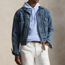 Model wearing Ralph Lauren Pebble Blue hoodie, styled with mid-wash denim jacket and white jeans.