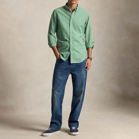 Model wearing Ralph Lauren Faded Mint regular fit casual shirt with blue jeans and navy trainers
