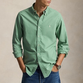Model wearing Ralph Lauren Faded Mint cotton reg shirt with button-down collar, styled with blue jeans and a watch.