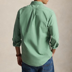 Model wearing Ralph Lauren Faded Mint Reg Shirt, rear view with rolled sleeves, styled with blue jeans