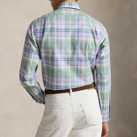 Model wearing Ralph Lauren Reg Shirt in faded mint lavender multi plaid, back view, styled with white trousers and brown belt