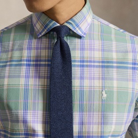 Model wearing Ralph Lauren Reg Shirt in faded mint lavender multi plaid, styled with a navy textured tie